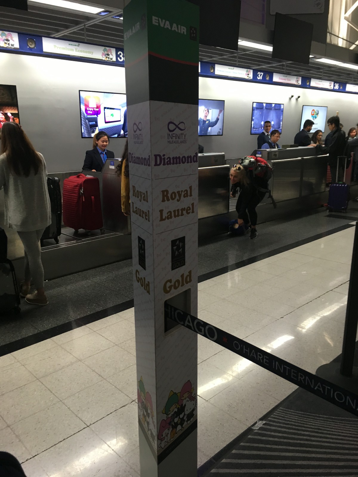 Check-in sign. Note the Sanrio characters below